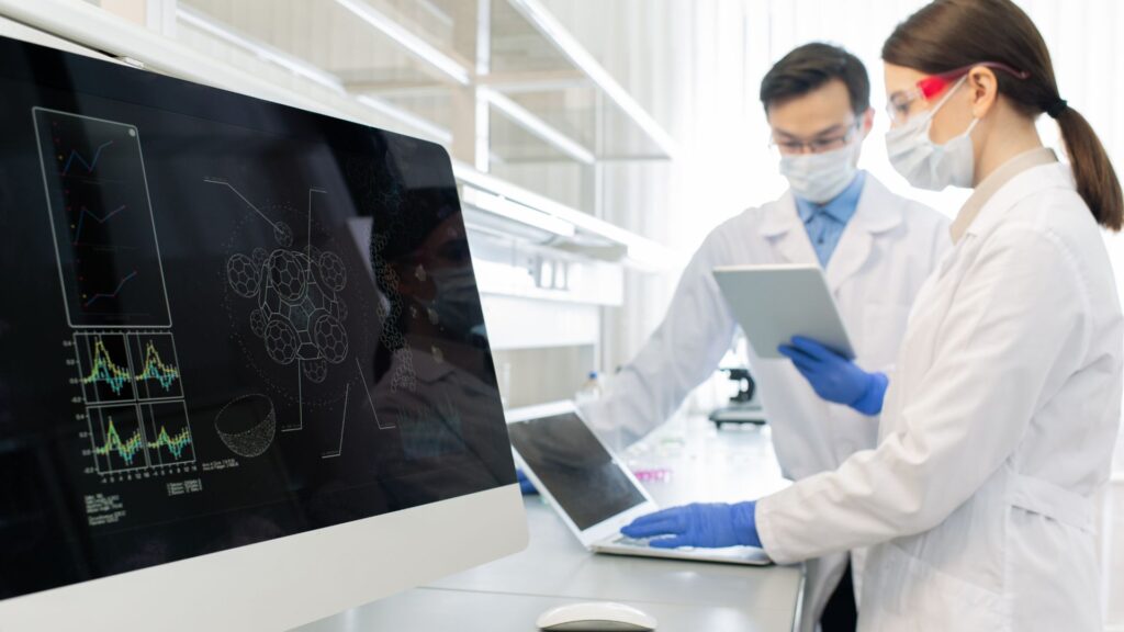 scientists working on the computer