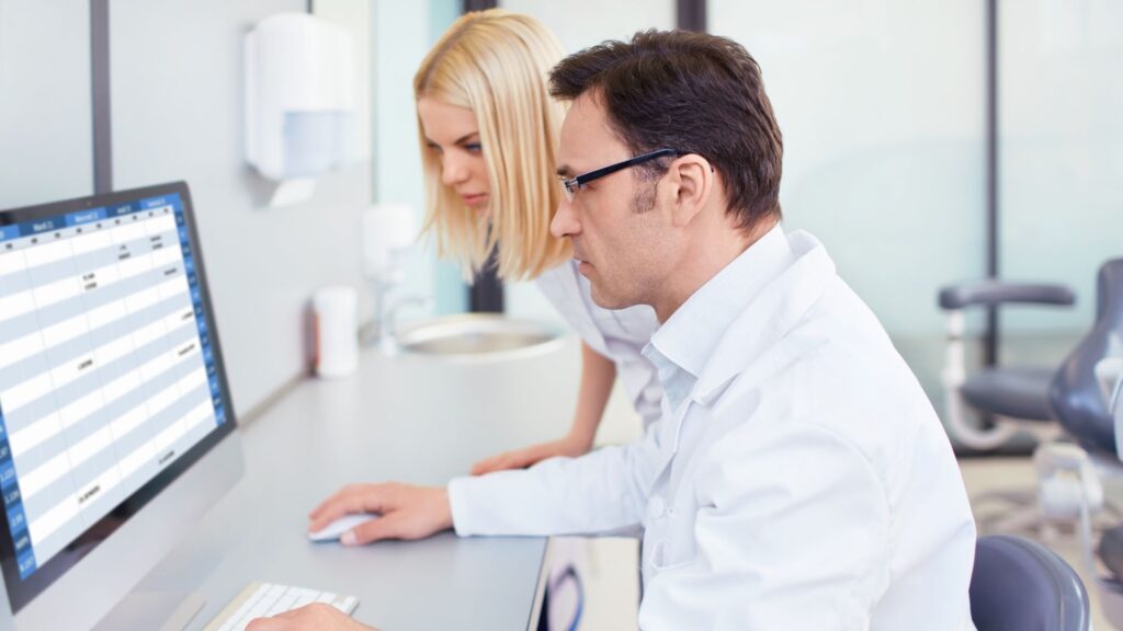 scientists conducting research on the computer