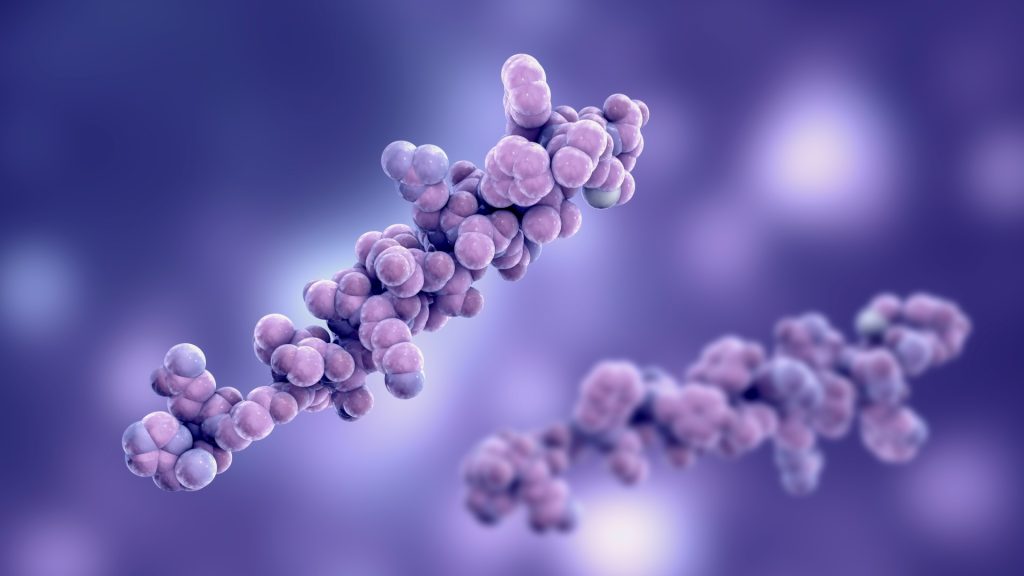 3D-rendered close-up of two purple and pink molecular structures against a blurred purple background, intricately showcasing the complexity of multi-omics data.