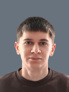 A young adult with short brown hair, light skin, and a neutral expression, wearing a dark crew neck shirt, facing forward against a plain gray background—representing the professionalism of Delta4's team.