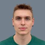 A young person with short light brown hair, wearing small hoop earrings and a green shirt, stands facing forward against a plain gray background—representing Delta4's team spirit.